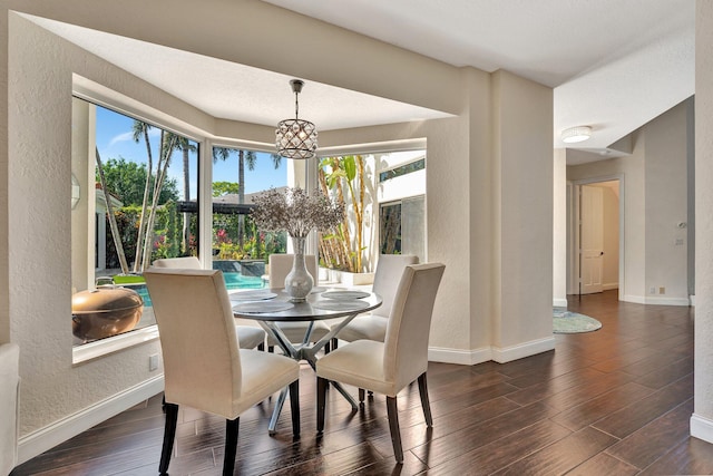 6131 NW 30th Ave, Boca Raton, FL 33496 - dining room featuring baseboards, a notable chandelier, dark wood finished floors, and a textured wall