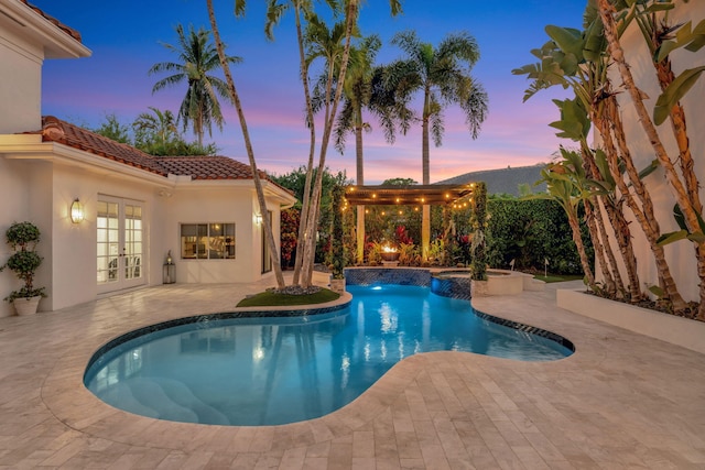 6131 NW 30th Ave, Boca Raton, FL 33496 - view of swimming pool featuring french doors, a pool with connected hot tub, and a patio area