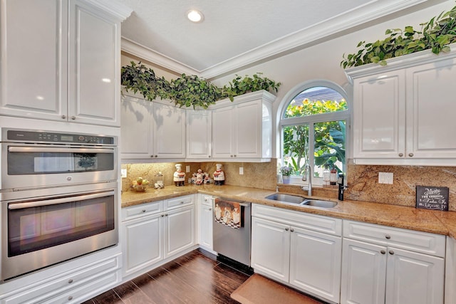 6131 NW 30th Ave, Boca Raton, FL 33496 - kitchen featuring ornamental molding, appliances with stainless steel finishes, white cabinets, and a sink
