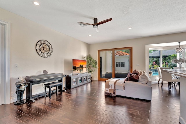 6131 NW 30th Ave, Boca Raton, FL 33496 - living room with recessed lighting, ceiling fan with notable chandelier, a textured ceiling, and wood finished floors