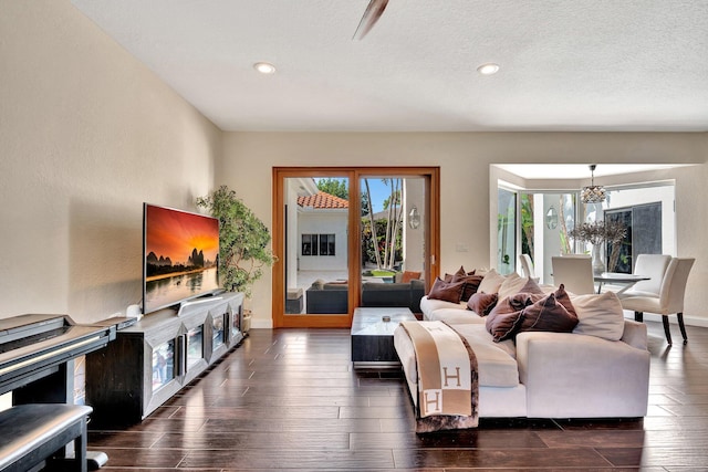6131 NW 30th Ave, Boca Raton, FL 33496 - living area with a chandelier, recessed lighting, a textured ceiling, and dark wood-type flooring