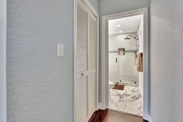 6131 NW 30th Ave, Boca Raton, FL 33496 - hallway featuring wood finished floors and a textured wall