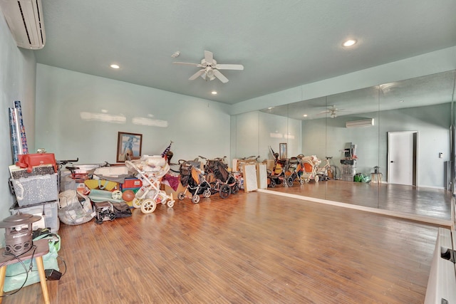 6131 NW 30th Ave, Boca Raton, FL 33496 - misc room featuring wood finished floors, recessed lighting, a ceiling fan, and a wall mounted air conditioner