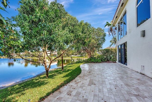 6131 NW 30th Ave, Boca Raton, FL 33496 - view of patio featuring a water view