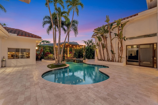 6131 NW 30th Ave, Boca Raton, FL 33496 - pool at dusk with a patio area and a pool with connected hot tub