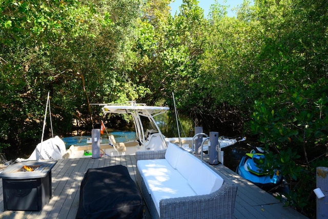 11753 Landing Pl, Palm Beach Gardens, FL 33408 - wooden terrace with a dock and an outdoor fire pit