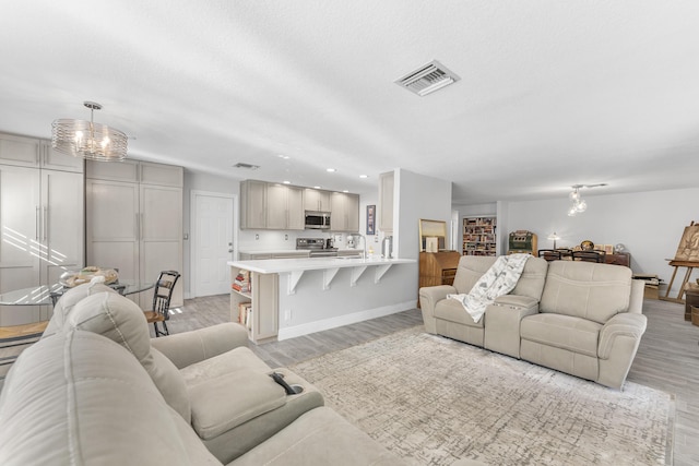 334 NW 42nd St, Boca Raton, FL 33431 - living area featuring baseboards, visible vents, and light wood-type flooring