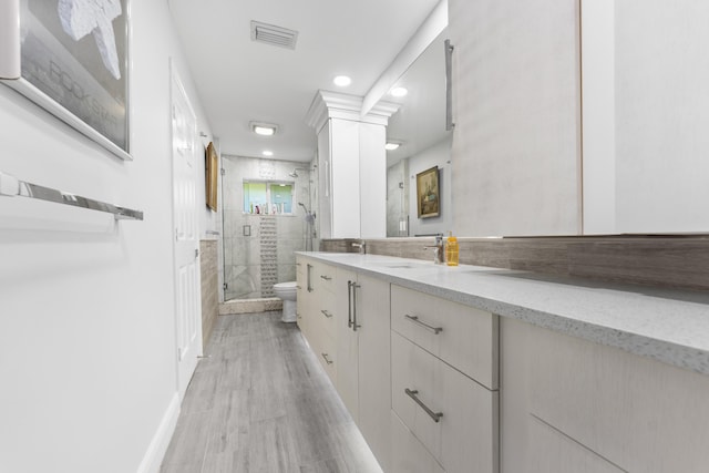 334 NW 42nd St, Boca Raton, FL 33431 - full bathroom featuring visible vents, a shower stall, baseboards, toilet, and vanity