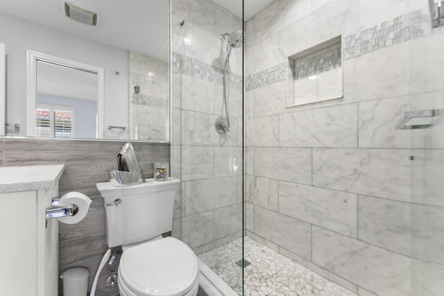 334 NW 42nd St, Boca Raton, FL 33431 - full bathroom with toilet, tile walls, and a tile shower