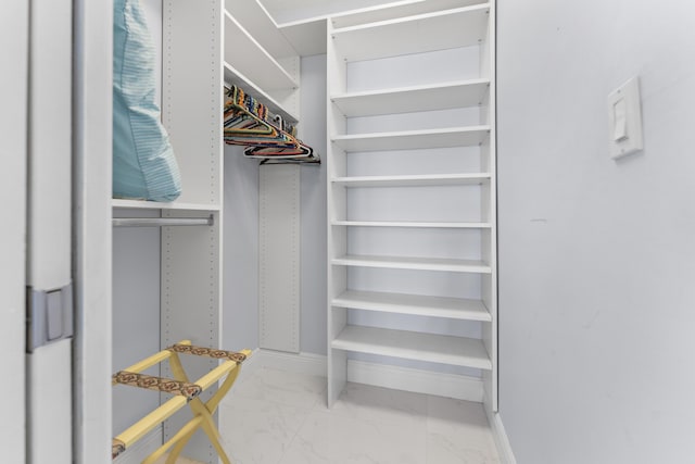 334 NW 42nd St, Boca Raton, FL 33431 - walk in closet featuring marble finish floor