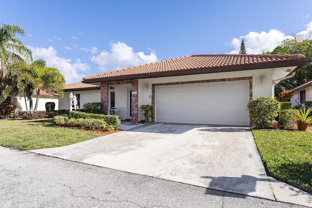 334 NW 42nd St, Boca Raton, FL 33431 - view of front of house with stucco siding, concrete driveway, a front lawn, a garage, and a tiled roof
