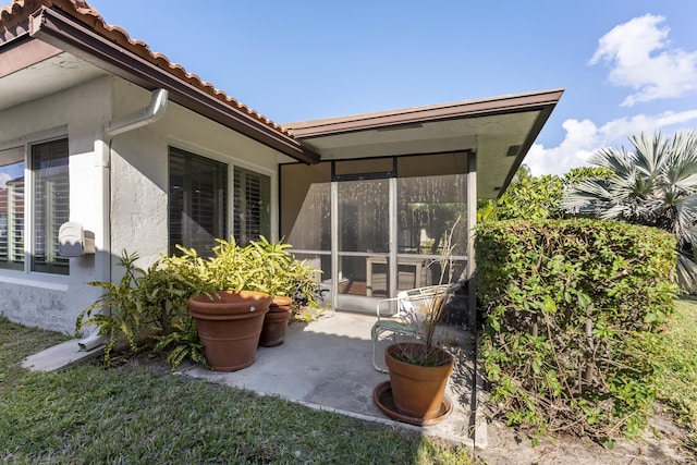 334 NW 42nd St, Boca Raton, FL 33431 - view of patio / terrace with a sunroom