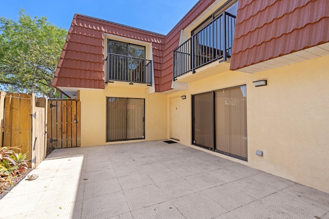 9919 NW 6th Ct, Plantation, FL 33324 - view of patio / terrace featuring a gate and a balcony