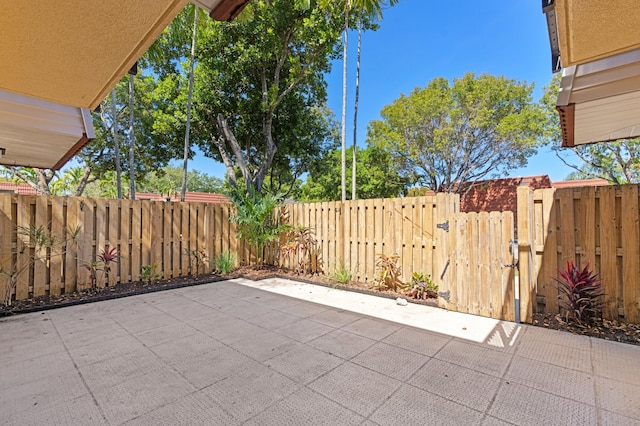 9919 NW 6th Ct, Plantation, FL 33324 - view of patio / terrace featuring a gate and a fenced backyard