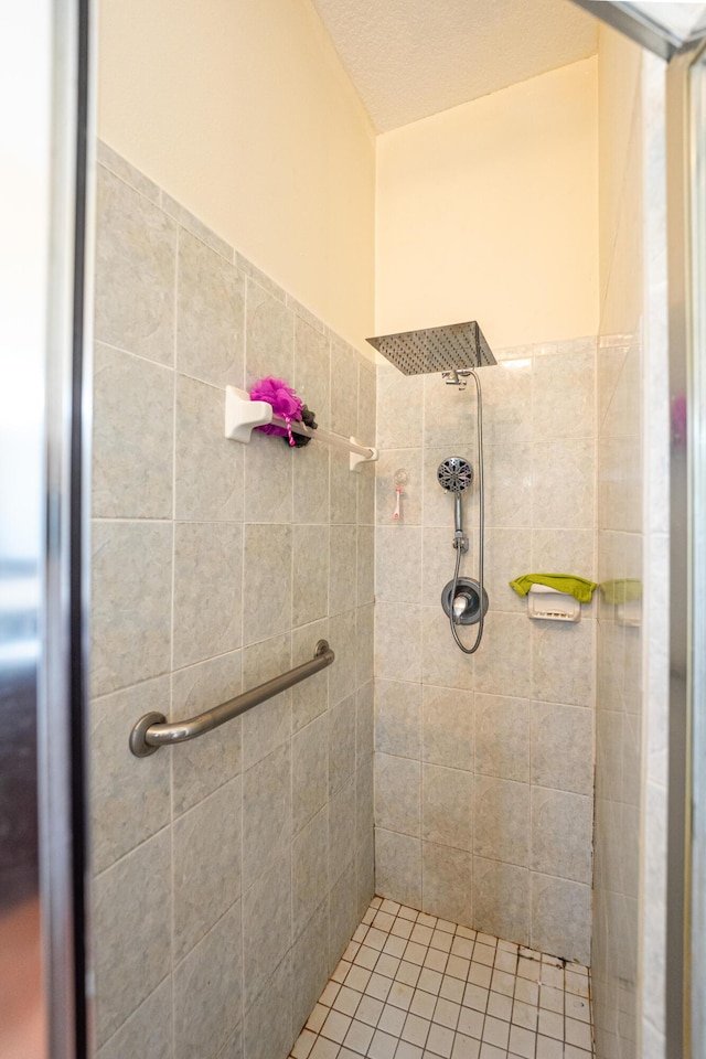 full bath featuring tiled shower