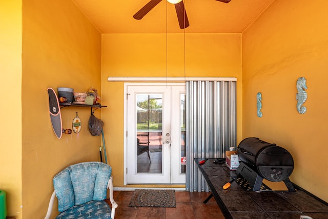 entryway with a ceiling fan, french doors, and tile patterned floors