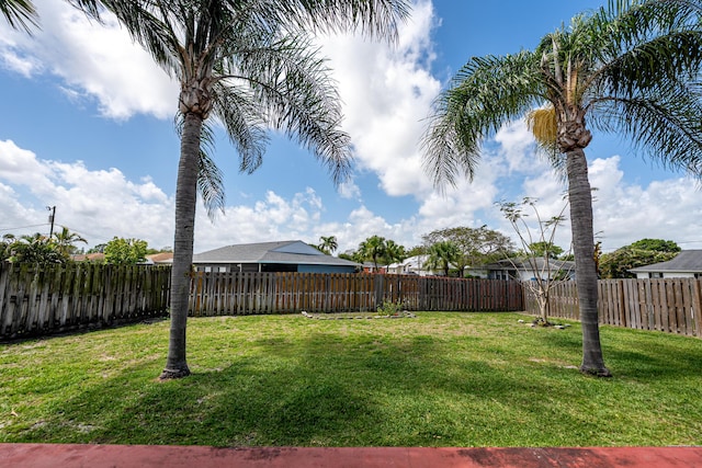 view of yard with a fenced backyard