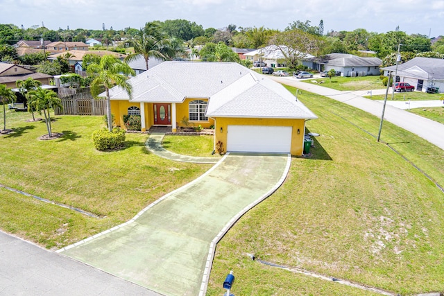 single story home with fence, driveway, a residential view, and a garage