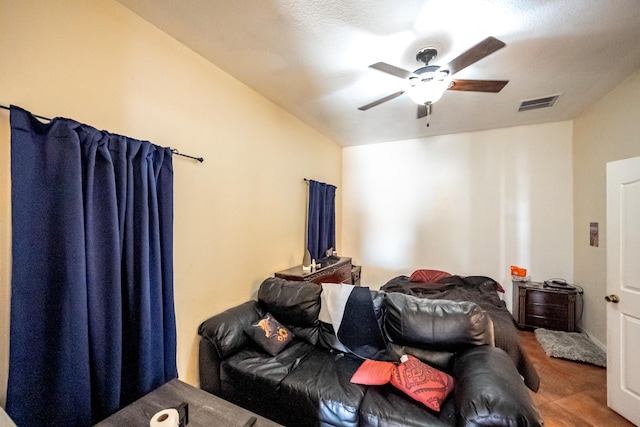 bedroom featuring lofted ceiling, visible vents, and ceiling fan