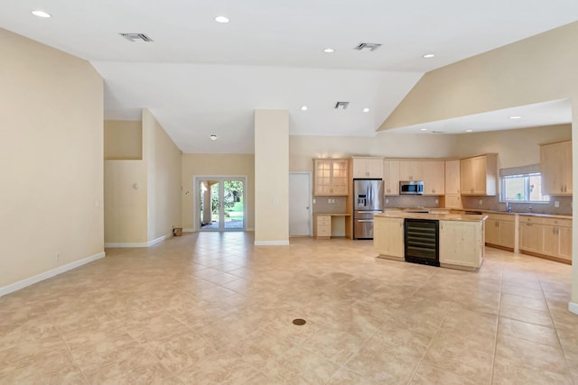 unfurnished room with lofted ceiling, baseboards, and recessed lighting