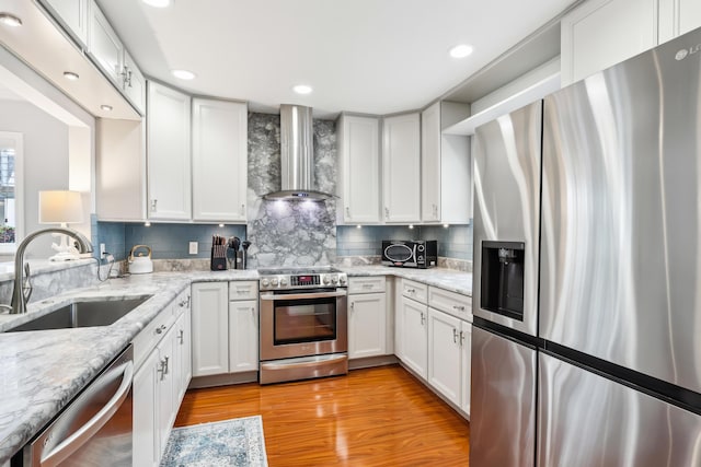 206 Lake Susan Ln, West Palm Beach, FL 33411 - kitchen with decorative backsplash, appliances with stainless steel finishes, wall chimney exhaust hood, and a sink