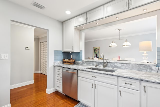 206 Lake Susan Ln, West Palm Beach, FL 33411 - kitchen featuring visible vents, ornamental molding, stainless steel dishwasher, white cabinets, and a sink