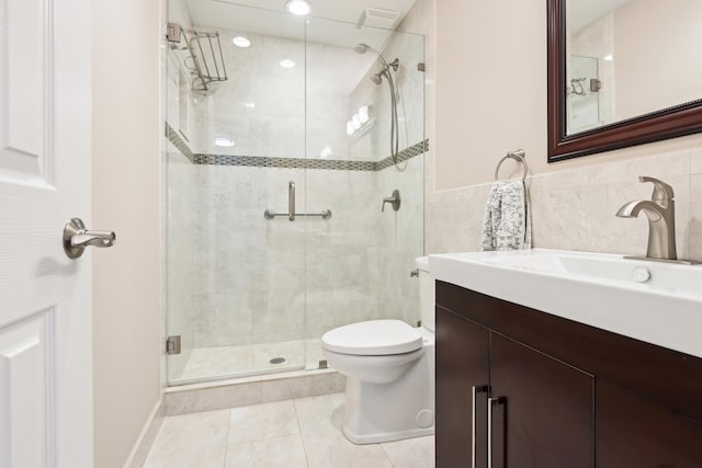 206 Lake Susan Ln, West Palm Beach, FL 33411 - bathroom featuring tile patterned flooring, a shower stall, toilet, and vanity