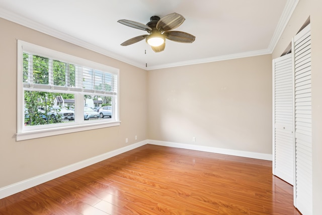 206 Lake Susan Ln, West Palm Beach, FL 33411 - unfurnished bedroom featuring a ceiling fan, crown molding, baseboards, and wood finished floors
