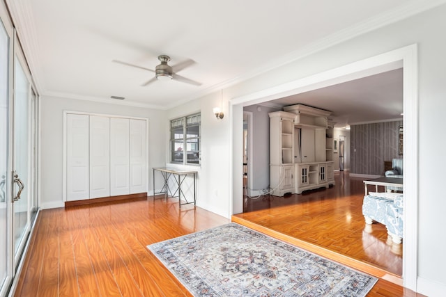 206 Lake Susan Ln, West Palm Beach, FL 33411 - interior space featuring ornamental molding, baseboards, ceiling fan, and wood finished floors