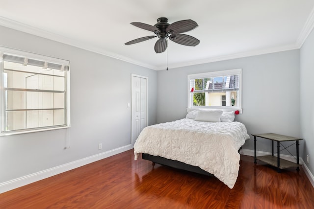 206 Lake Susan Ln, West Palm Beach, FL 33411 - bedroom with dark wood-type flooring, crown molding, baseboards, and a closet