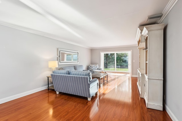 206 Lake Susan Ln, West Palm Beach, FL 33411 - living room featuring visible vents, ornamental molding, baseboards, and wood finished floors