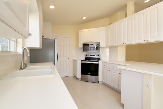 10828 SW Dardanelle Dr, Port Saint Lucie, FL 34987 - kitchen featuring white cabinets, appliances with stainless steel finishes, and a sink