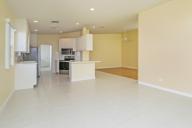 10828 SW Dardanelle Dr, Port Saint Lucie, FL 34987 - kitchen with visible vents, recessed lighting, light countertops, appliances with stainless steel finishes, and open floor plan