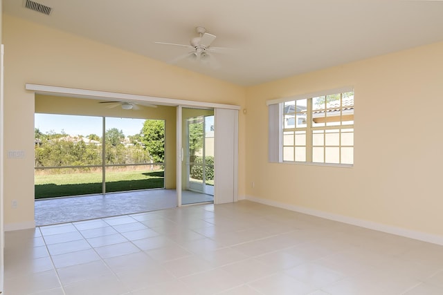 10828 SW Dardanelle Dr, Port Saint Lucie, FL 34987 - empty room with tile patterned flooring, visible vents, ceiling fan, and vaulted ceiling
