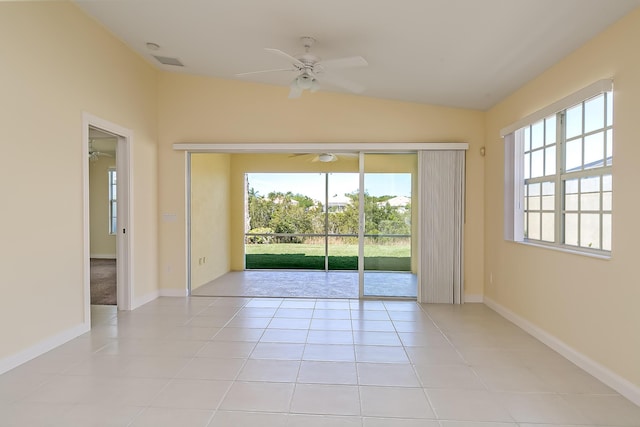10828 SW Dardanelle Dr, Port Saint Lucie, FL 34987 - spare room with light tile patterned floors, baseboards, ceiling fan, and vaulted ceiling