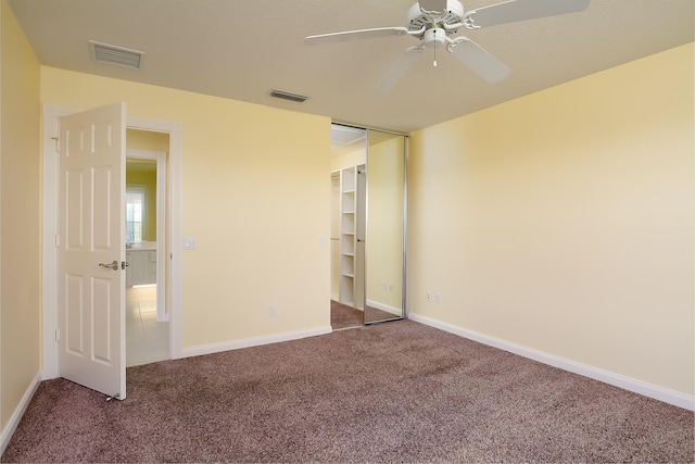 10828 SW Dardanelle Dr, Port Saint Lucie, FL 34987 - unfurnished bedroom with visible vents, baseboards, carpet, and a ceiling fan