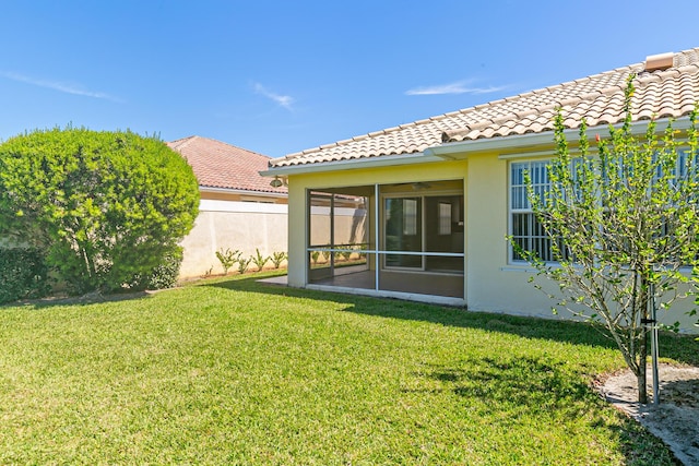 10828 SW Dardanelle Dr, Port Saint Lucie, FL 34987 - view of yard featuring fence and a sunroom