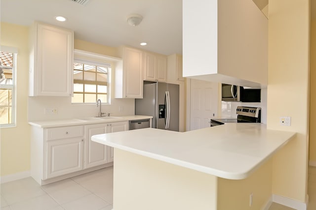 10828 SW Dardanelle Dr, Port Saint Lucie, FL 34987 - kitchen featuring a peninsula, recessed lighting, appliances with stainless steel finishes, and a sink