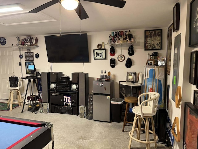 rec room with ceiling fan