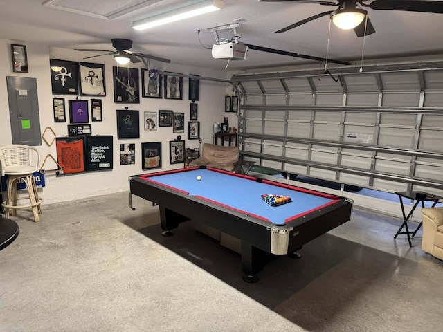 playroom with concrete flooring, billiards, a ceiling fan, and electric panel
