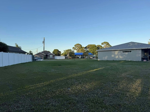view of yard with fence