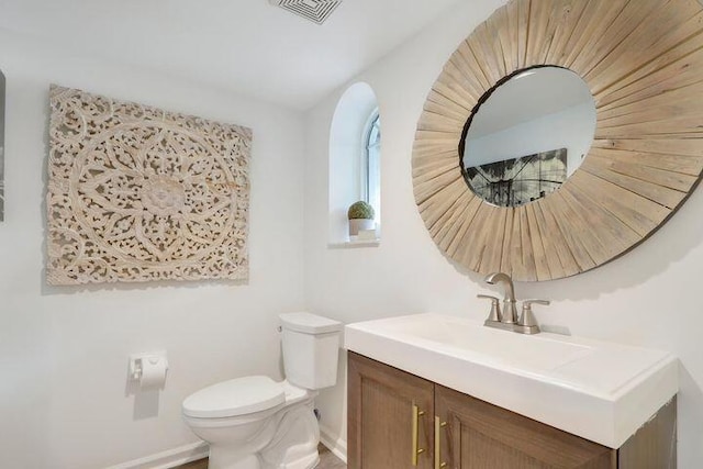 1000 N US Highway 1 Unit 656, Jupiter, FL 33477 - bathroom featuring visible vents, toilet, vanity, and baseboards