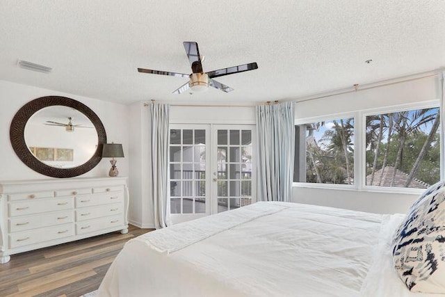 1000 N US Highway 1 Unit 656, Jupiter, FL 33477 - bedroom featuring visible vents, a ceiling fan, wood finished floors, and a textured ceiling
