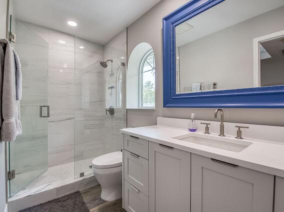 1000 N US Highway 1 Unit 656, Jupiter, FL 33477 - bathroom with toilet, a stall shower, and vanity