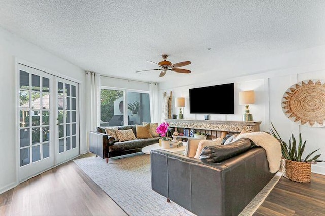 1000 N US Highway 1 Unit 656, Jupiter, FL 33477 - living area featuring french doors, a ceiling fan, wood finished floors, and a textured ceiling