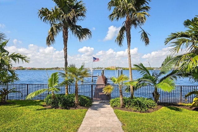 exterior space with fence and a boat dock