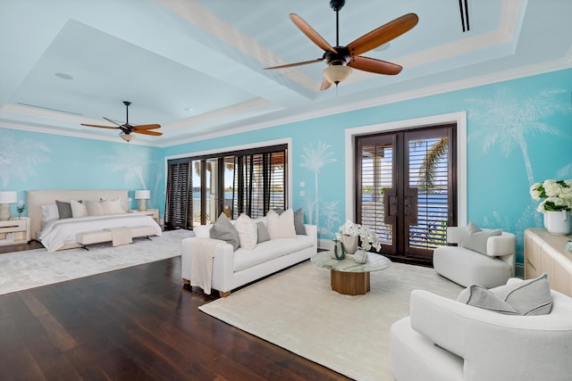 living room with french doors, dark wood-style floors, a raised ceiling, ceiling fan, and ornamental molding