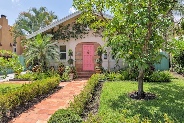 426 30th St, West Palm Beach, FL 33407 - foyer with wood finished floors, baseboards, recessed lighting, and arched walkways