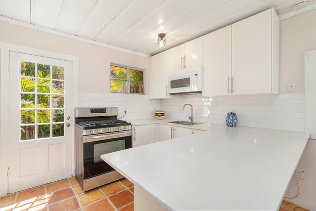 426 30th St, West Palm Beach, FL 33407 - full bathroom featuring toilet, a sink, tile walls, a shower stall, and recessed lighting