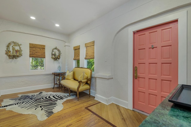 426 30th St, West Palm Beach, FL 33407 - living area with arched walkways, baseboards, visible vents, and wood finished floors